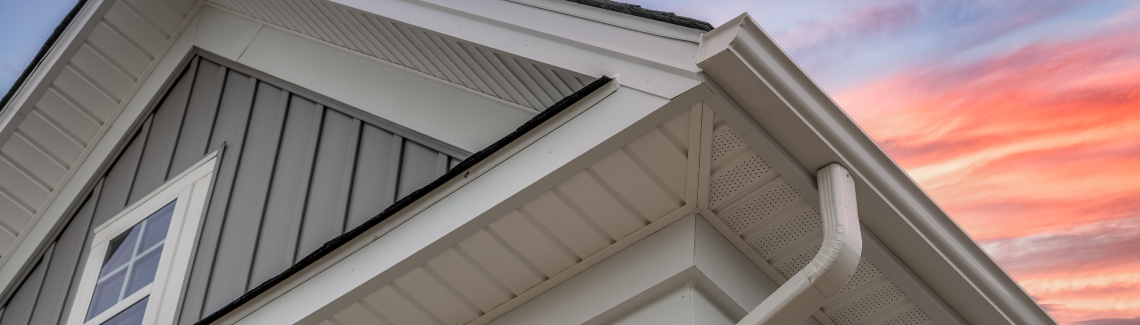 Gutter on new home with sunset